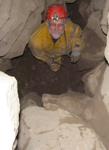 Dave Checkley looking up the excavated shaft at Stile Pot