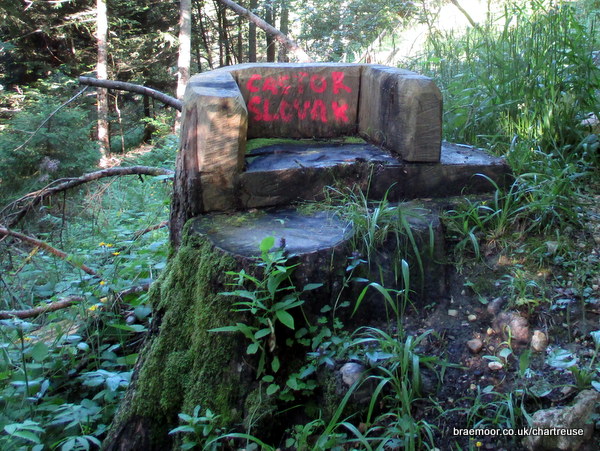Photograph of two carved tree stump seats seen on the way up to Col de la Saulce