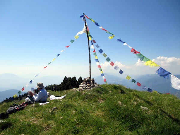 Photograph of the summit of Rocher de Chalves, Grande Sure, adorned with Budhist prayer flag