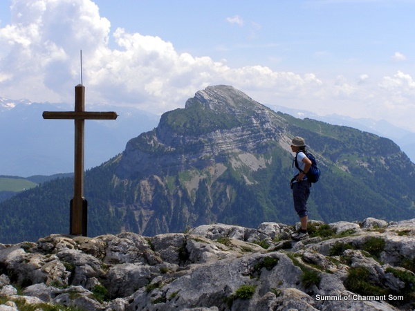 Photograph of the Charmant Som summit cross with Chamechaude behind