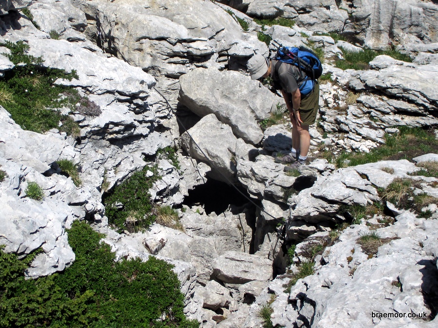 The entrance to P40 - the belay chains can be seen top left at the end of the traverse line